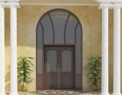 Elegant exterior door with a decorative arch and side panels, set against a stucco wall with potted plants on either side.