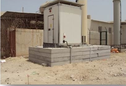 equipment shelter -A durable Hayat Communications Equipment shelter installed on a raised concrete platform, designed to withstand extreme weather conditions.