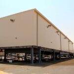 A large prefabricated substation (E-House) by Eaton Arabia, elevated on a platform, designed for oil, gas, and petrochemical applications.